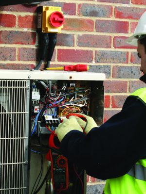 Engineer Working on Condensing Unit